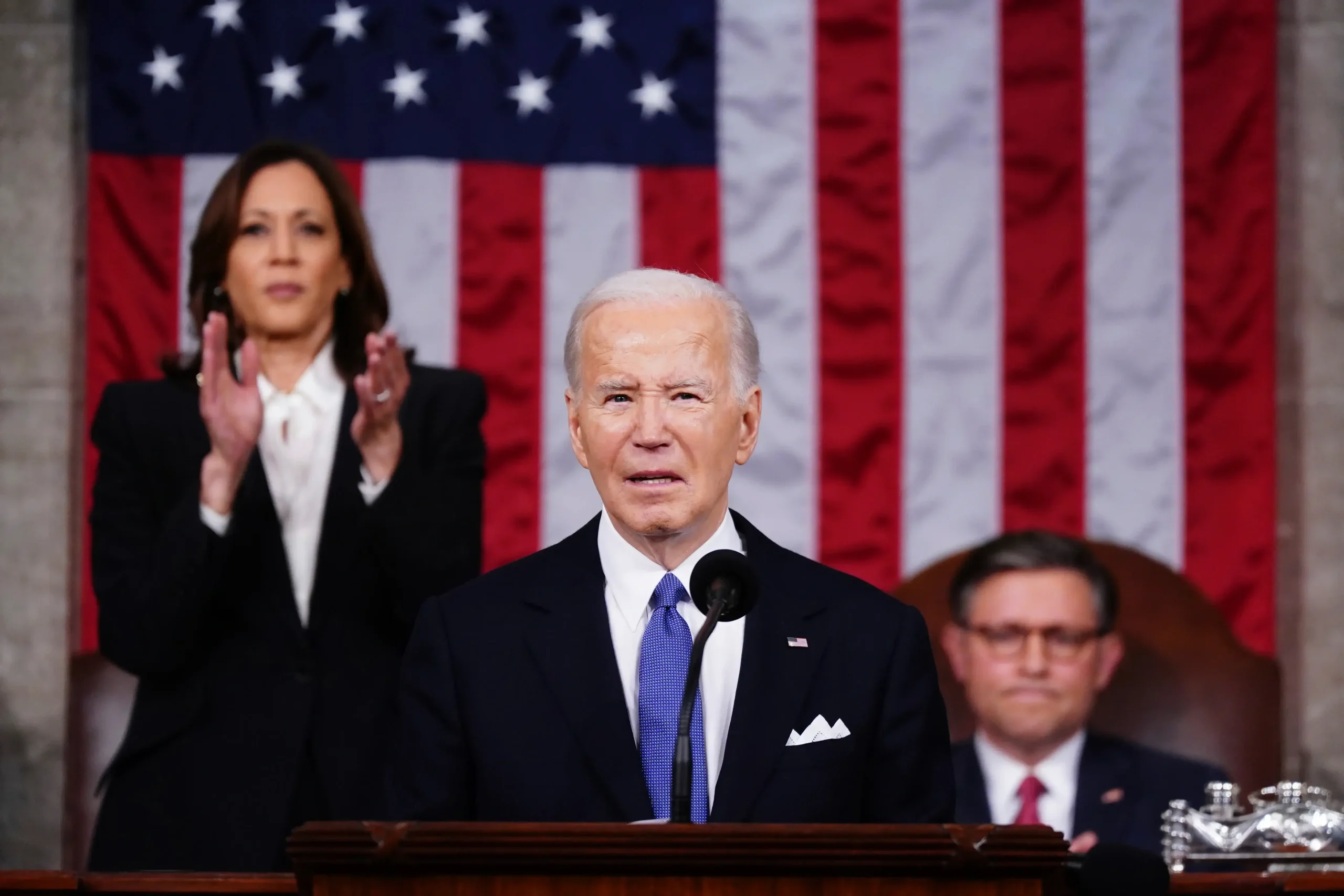 Biden addressing a crowd, emphasizing the importance of rebuilding alliances and restoring trust among global partners.