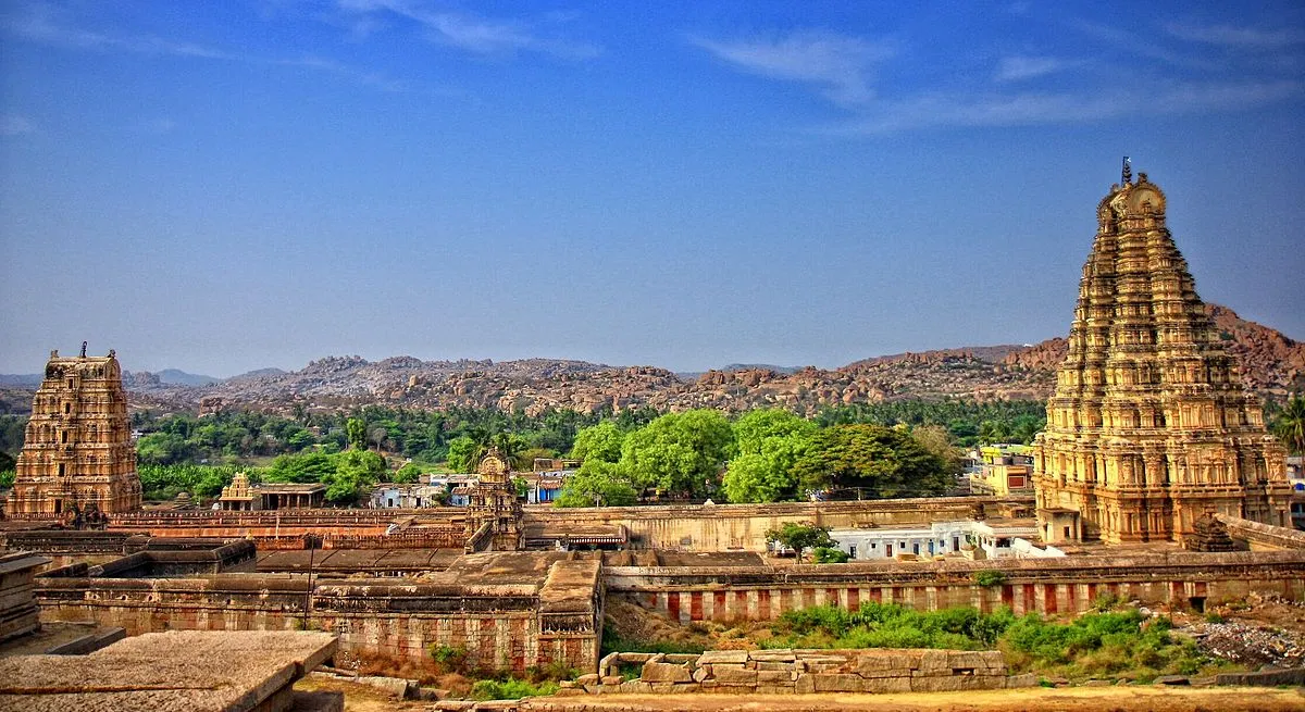 Virupaksha Temple, dedicated to Lord Shiva, showcasing intricate carvings and a towering gopuram.