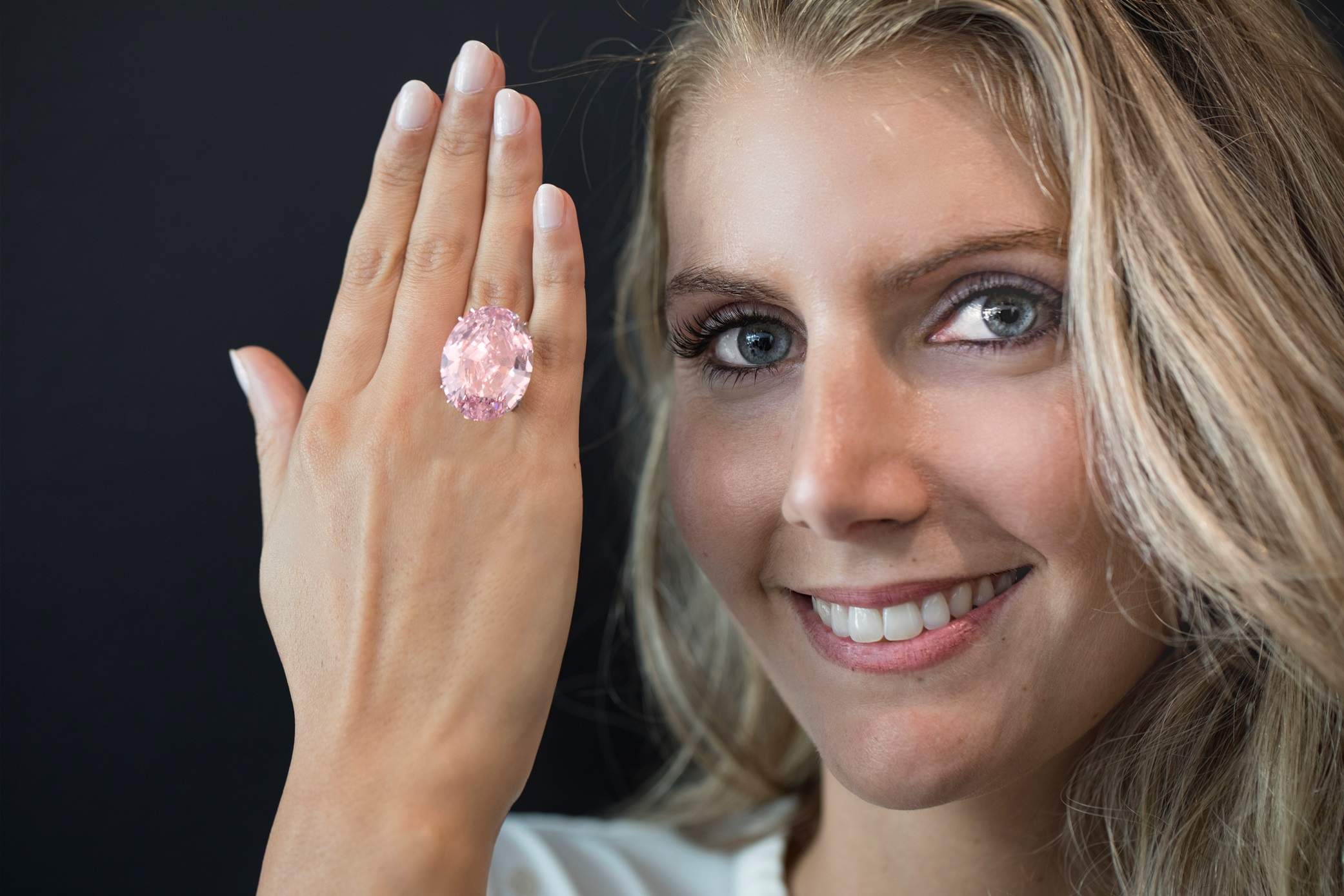 Close-up view of The Pink Star diamond, highlighting its intricate cut and the brilliance of its vivid pink hue.