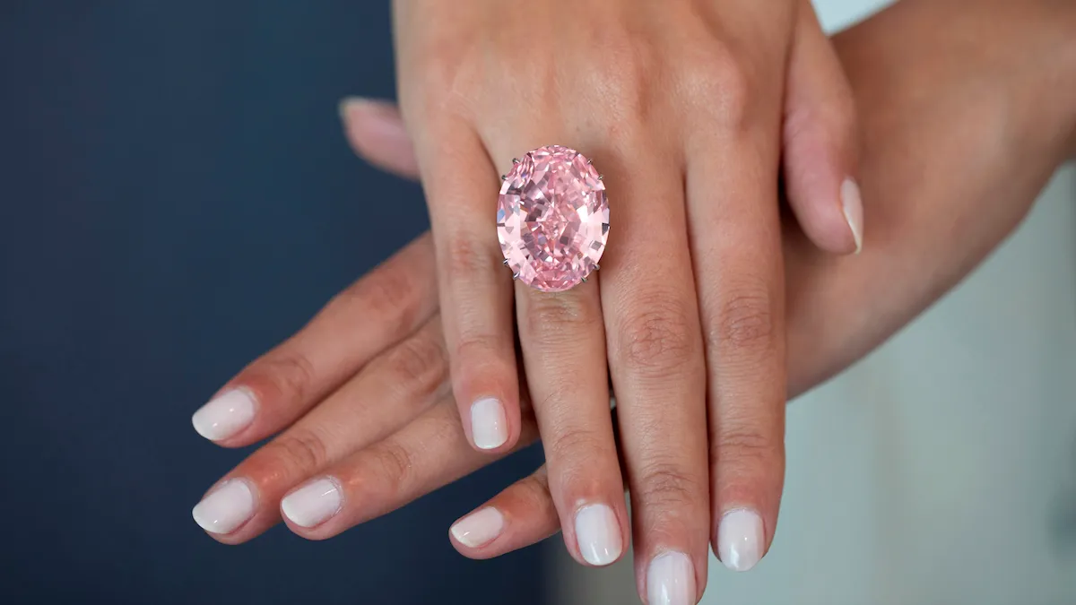 The Pink Star diamond displayed in a jewelry box, reflecting its prestigious status and extraordinary journey from mine to auction.