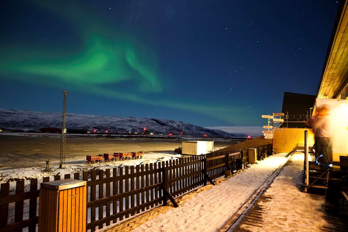 Panoramic view of Kangerlussuaq with snow-covered mountains and fjords