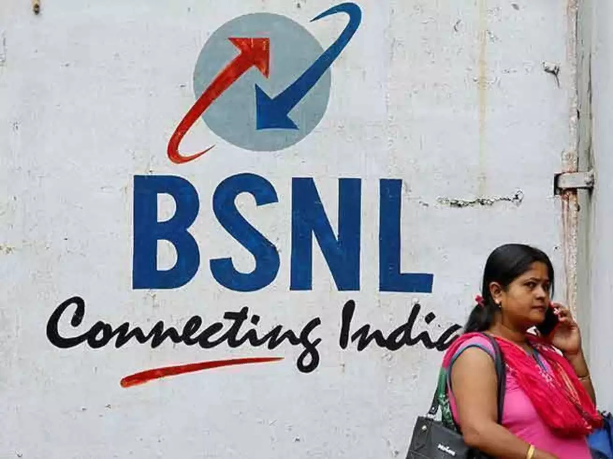 BSNL employees working on fiber optic cables 